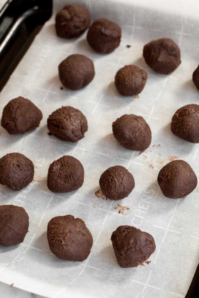 Dark chocolate raspberry truffles are so much easier to make than you think. It's as simple as combining quality chocolate, cream, raspberry jam, and cocoa. | aheadofthyme.com