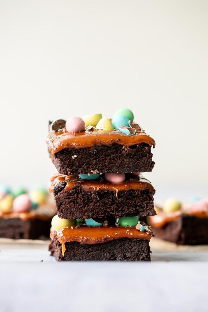 Rich, fudgy, and decadent, Easter egg caramel brownies are topped with an easy-to-make caramel sauce and topped with mini chocolate eggs. | aheadofthyme.com