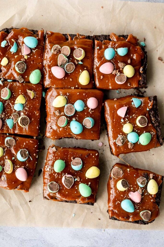Rich, fudgy, and decadent, Easter egg caramel brownies are topped with an easy-to-make caramel sauce and topped with mini chocolate eggs. | aheadofthyme.com