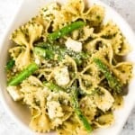 Spring pesto pasta with asparagus and chives is light and made with simple ingredients in under 20 minutes. Serve it hot for dinner or cold as pasta salad. | aheadofthyme.com