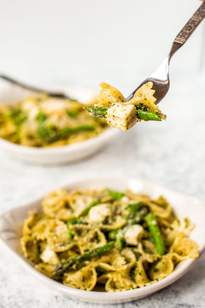 Spring pesto pasta with asparagus and chives is light and made with simple ingredients in under 20 minutes. Serve it hot for dinner or cold as pasta salad. | aheadofthyme.com