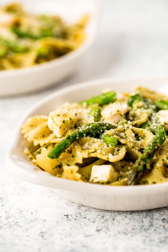 Spring pesto pasta with asparagus and chives is light and made with simple ingredients in under 20 minutes. Serve it hot for dinner or cold as pasta salad. | aheadofthyme.com