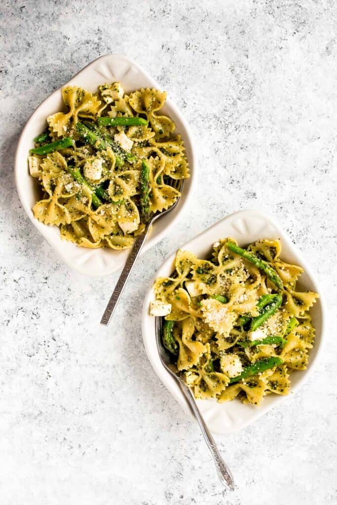 Spring pesto pasta with asparagus and chives is light and made with simple ingredients in under 20 minutes. Serve it hot for dinner or cold as pasta salad. | aheadofthyme.com