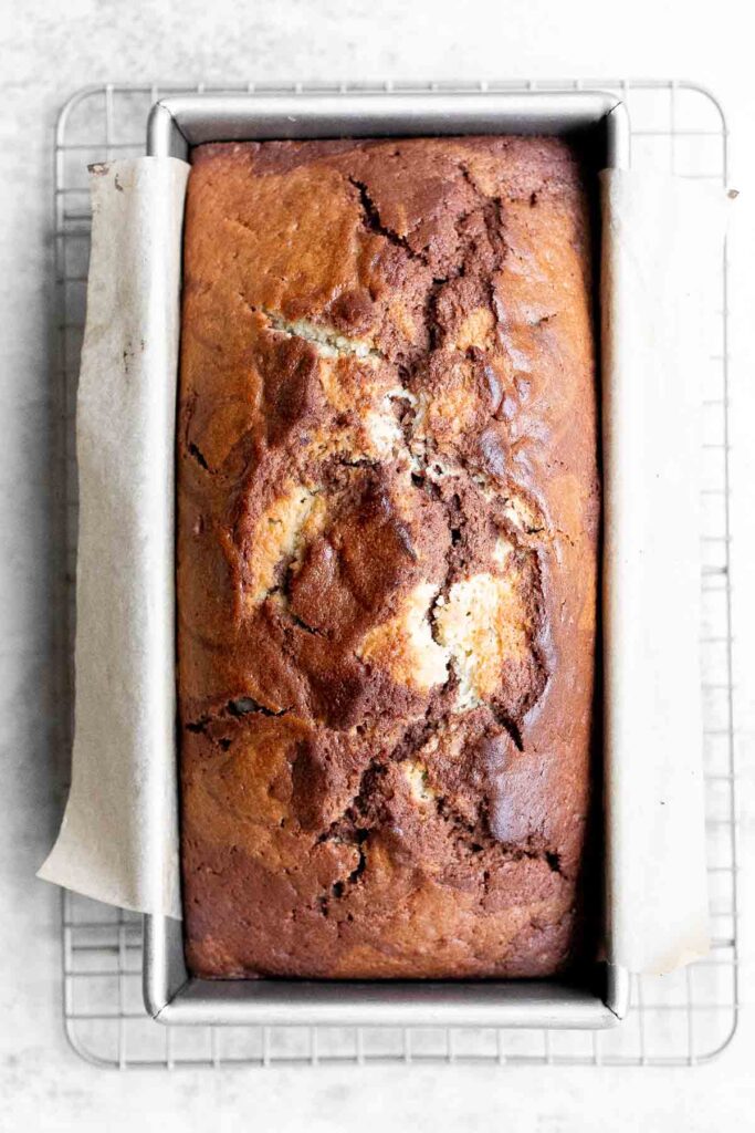 Chocolate and vanilla marble cake is delicious, moist, fluffy with the perfect golden brown crust. With two classic cake flavors, this loaf cake has it all. | aheadofthyme.com