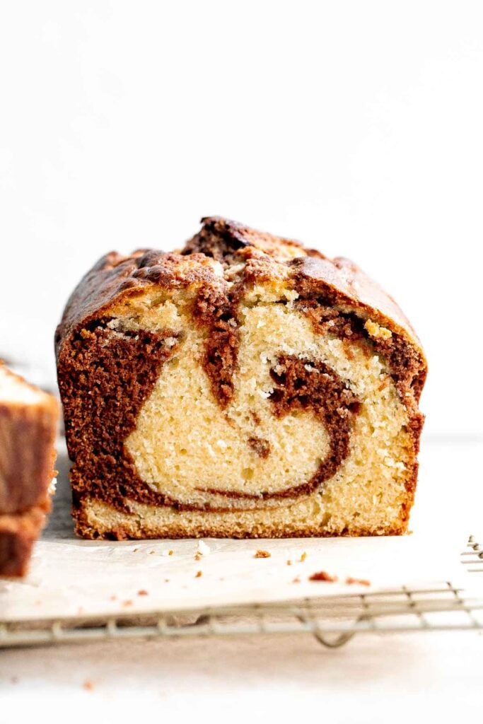 Chocolate and vanilla marble cake is delicious, moist, fluffy with the perfect golden brown crust. With two classic cake flavors, this loaf cake has it all. | aheadofthyme.com