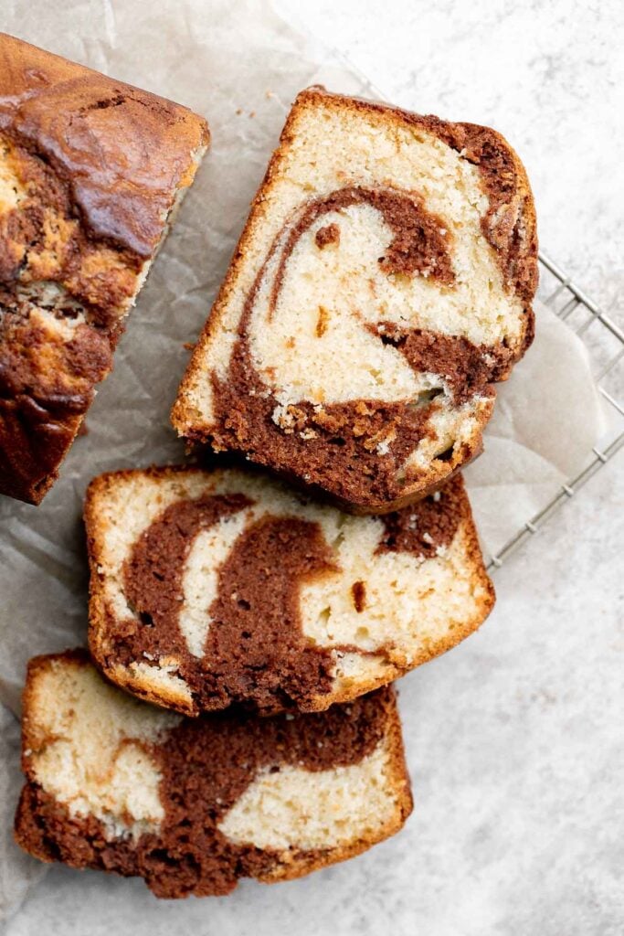 Chocolate and vanilla marble cake is delicious, moist, fluffy with the perfect golden brown crust. With two classic cake flavors, this loaf cake has it all. | aheadofthyme.com