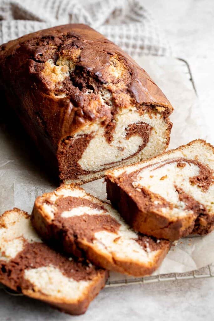 Chocolate and vanilla marble cake is delicious, moist, fluffy with the perfect golden brown crust. With two classic cake flavors, this loaf cake has it all. | aheadofthyme.com