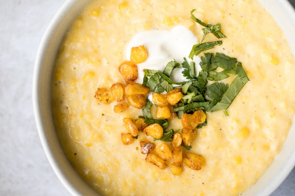 This vegetarian, hearty and filling, creamy Mexican corn soup is dense, bright, and full of flavour! It is the perfect Cinco de Mayo recipe. | aheadofthyme.com