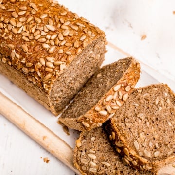 Learn how to make a delicious, golden brown loaf of homemade sunflower seed bread today! It is soft and fluffy on the inside, and crispy on the outside. | aheadofthyme.com