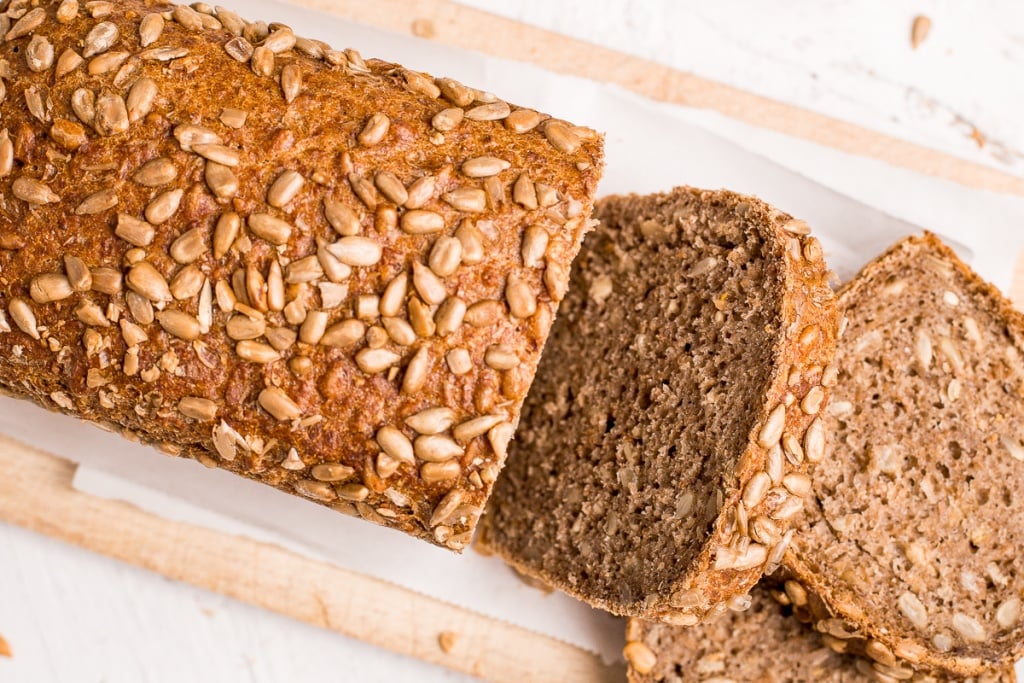 Learn how to make a delicious, golden brown loaf of homemade sunflower seed bread today! It is soft and fluffy on the inside, and crispy on the outside. | aheadofthyme.com