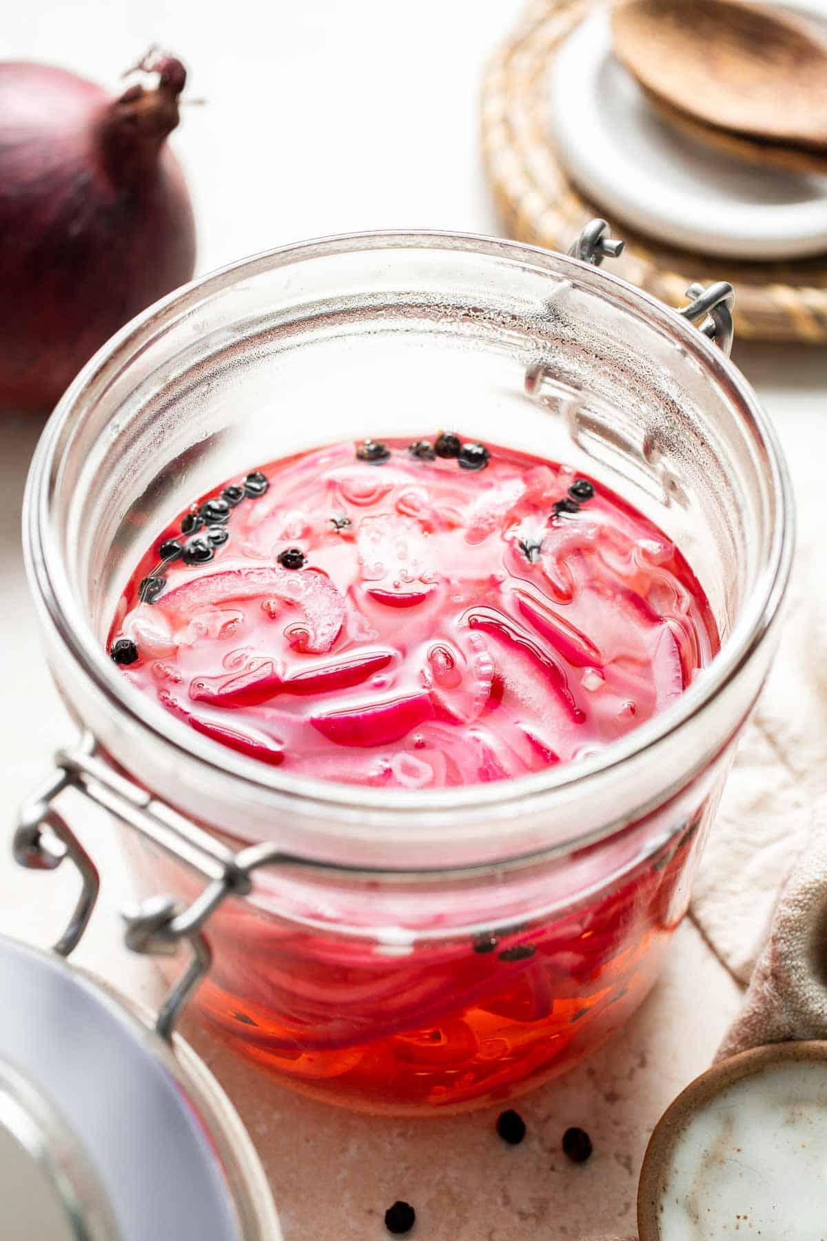Looking to add some tangy flavor to your meals? Try this simple recipe for pickled red onions that can be made in just a few minutes and stored for weeks! | aheadofthyme.com