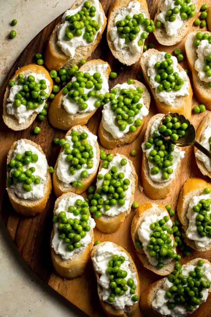 Ricotta Crostini with Peas and Mint is easily the most refreshing spring appetizer for any party. It's quick and easy to make and can be prepped ahead. | aheadofthyme.com