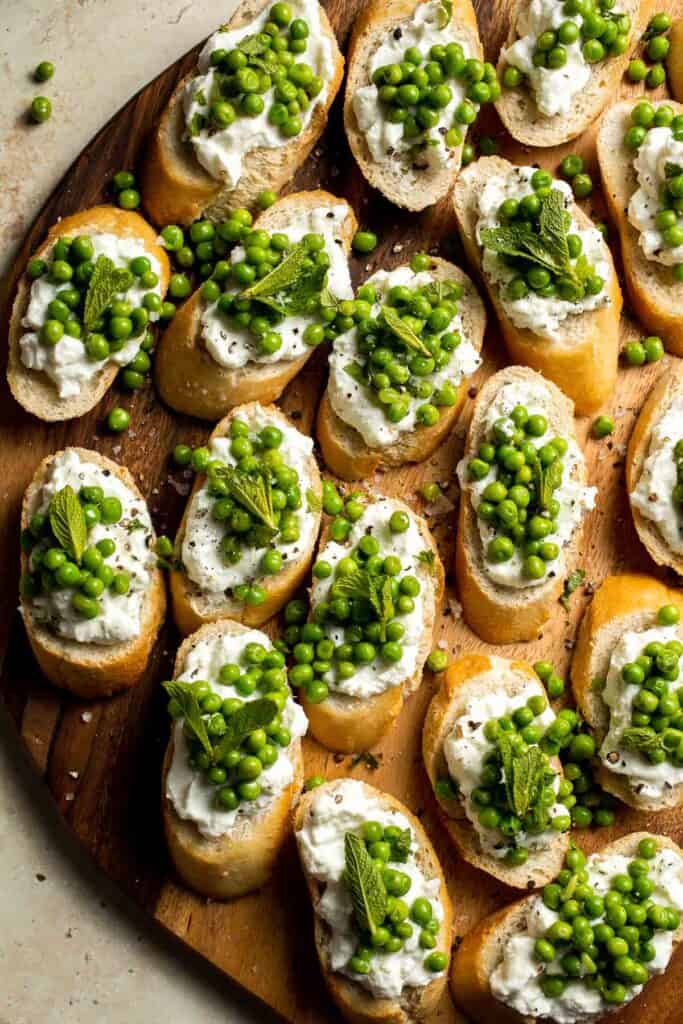 Ricotta Crostini with Peas and Mint is easily the most refreshing spring appetizer for any party. It's quick and easy to make and can be prepped ahead. | aheadofthyme.com