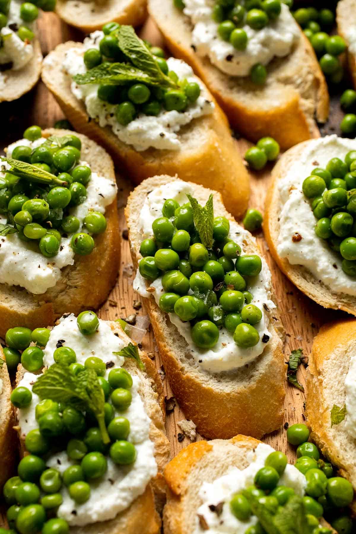 Ricotta Crostini with Peas and Mint is easily the most refreshing spring appetizer for any party. It's quick and easy to make and can be prepped ahead. | aheadofthyme.com