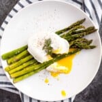 Roasted asparagus with poached eggs and fresh herbs is a classy, elevated spring meal that will leave you feeling light, but completely satisfied. | aheadofthyme.com