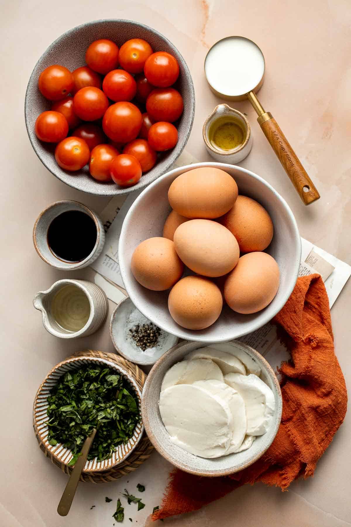 Caprese Frittata is light and fluffy, laced with fresh basil and topped with melted mozzarella cheese and blistered balsamic tomatoes. Ready in 10 minutes! | aheadofthyme.com