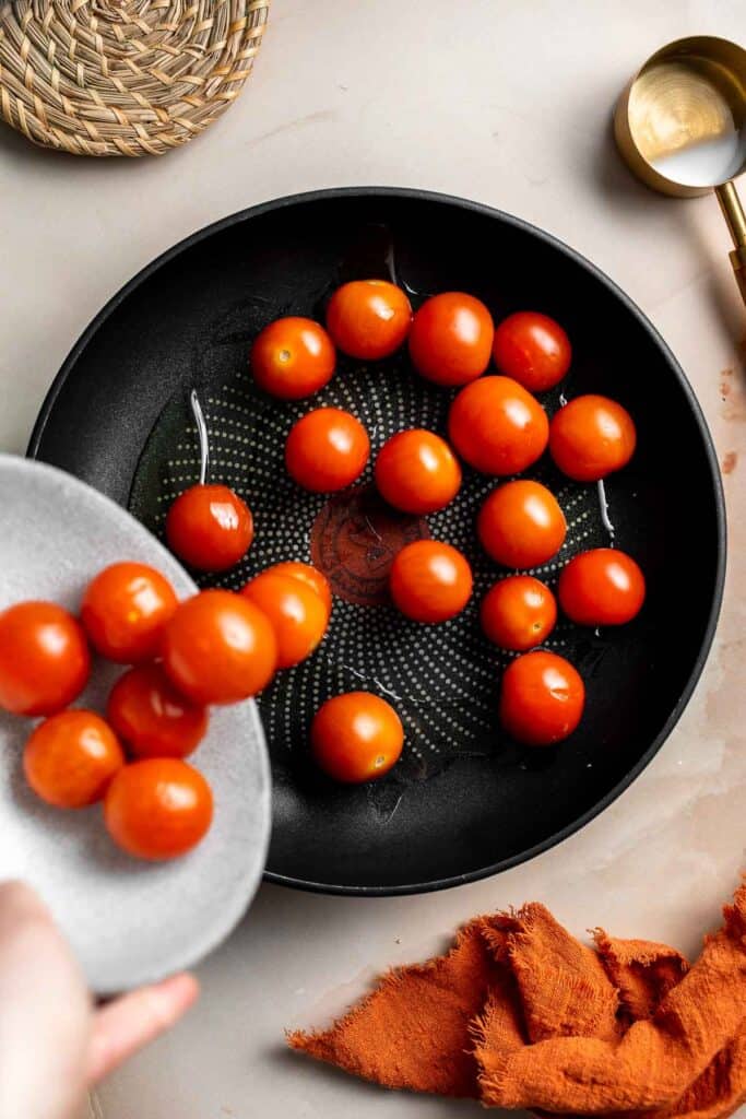 Caprese Frittata is light and fluffy, laced with fresh basil and topped with melted mozzarella cheese and blistered balsamic tomatoes. Ready in 10 minutes! | aheadofthyme.com