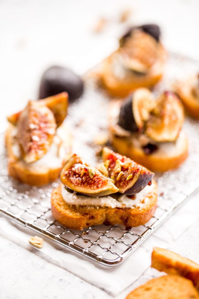 Fig crostini topped sweet, juicy figs, tangy goat cheese and crunchy pistachios is flavourful, delicious, and perfect for snacking on or entertaining. | aheadofthyme.com