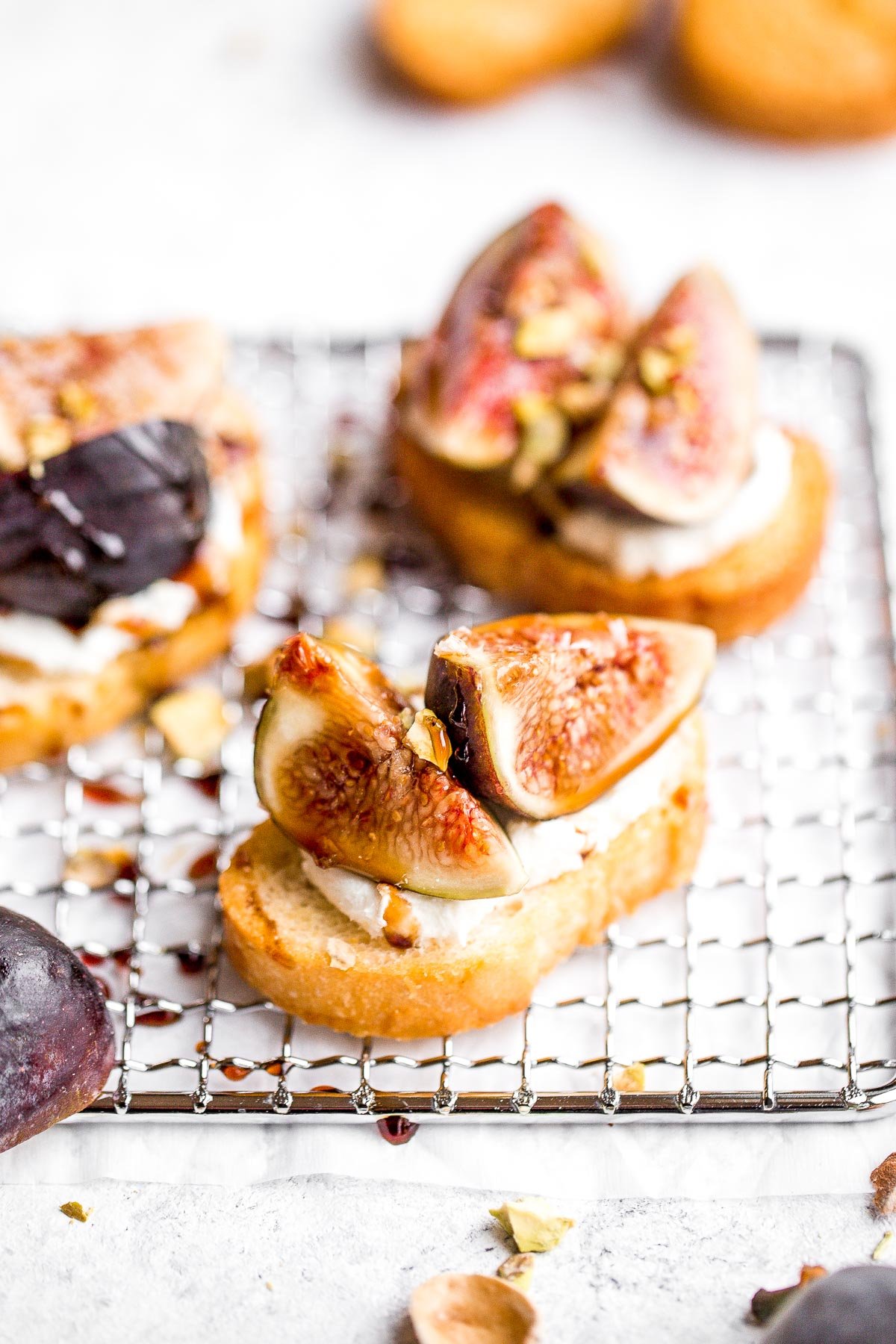 Fig crostini topped sweet, juicy figs, tangy goat cheese and crunchy pistachios is flavourful, delicious, and perfect for snacking on or entertaining. | aheadofthyme.com