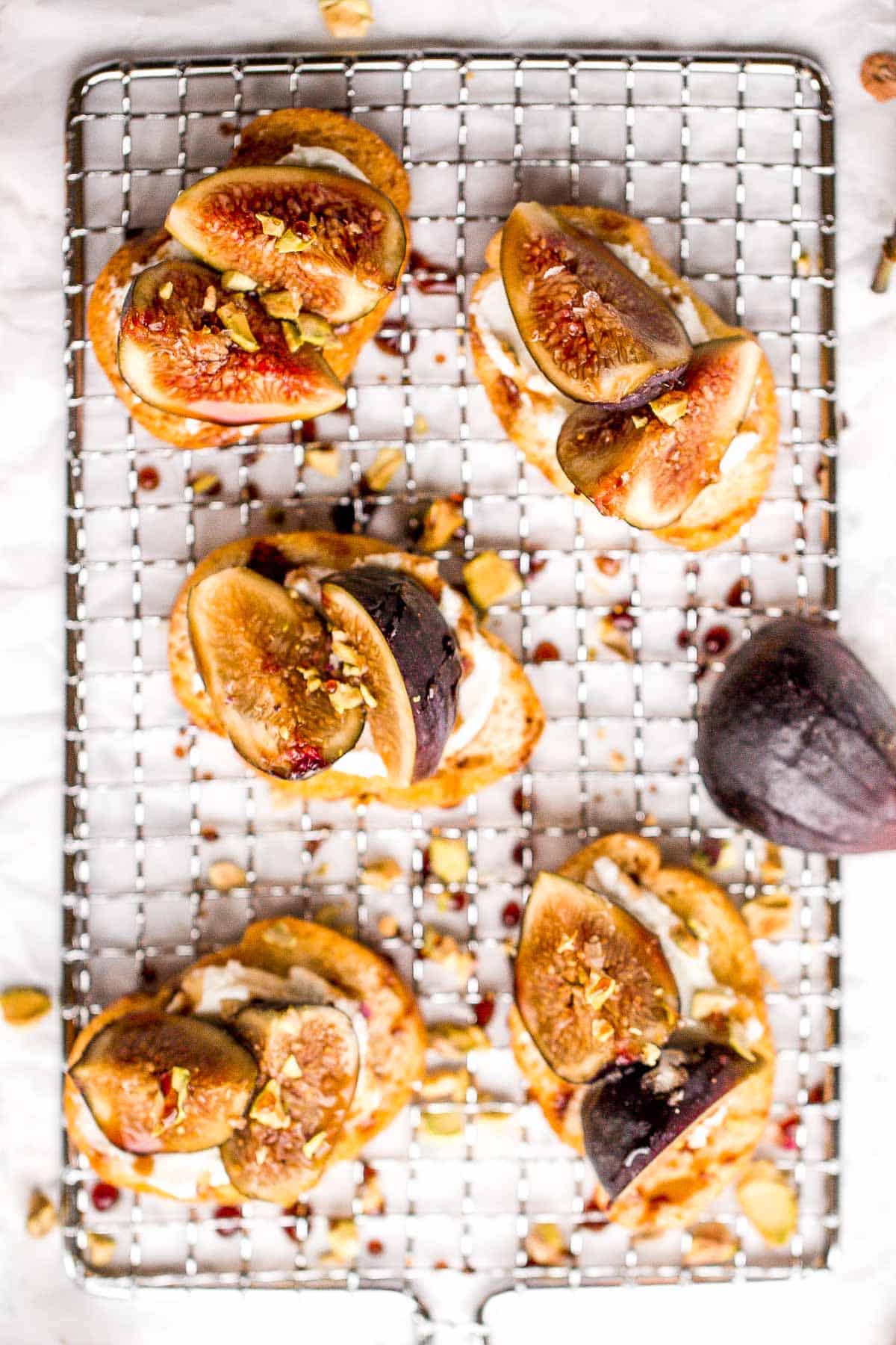 Fig crostini topped sweet, juicy figs, tangy goat cheese and crunchy pistachios is flavourful, delicious, and perfect for snacking on or entertaining. | aheadofthyme.com