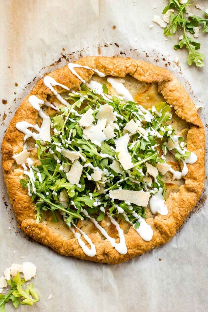 Potato galette with arugula and crème fraîche is a rich, light, and delicious savoury tart to serve for breakfast, lunch, or dinner. A total crowd-pleaser. | aheadofthyme.com