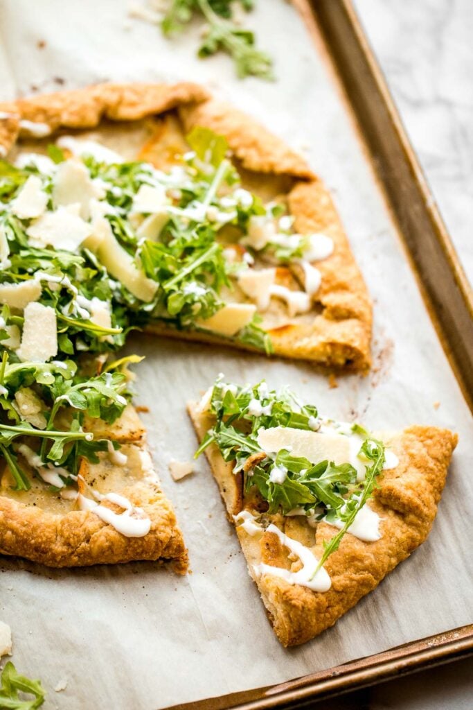 Potato galette with arugula and crème fraîche is a rich, light, and delicious savoury tart to serve for breakfast, lunch, or dinner. A total crowd-pleaser. | aheadofthyme.com