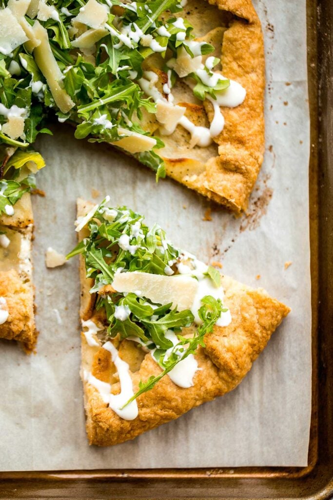 Potato galette with arugula and crème fraîche is a rich, light, and delicious savoury tart to serve for breakfast, lunch, or dinner. A total crowd-pleaser. | aheadofthyme.com