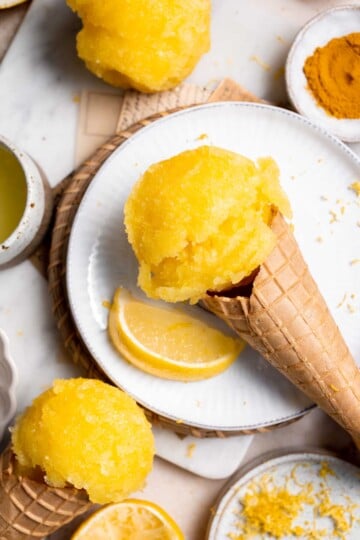 Looking for a refreshing summer treat? Try this easy, all-natural lemon sorbet, made with the added health benefits of turmeric for a bright yellow color. | aheadofthyme.com