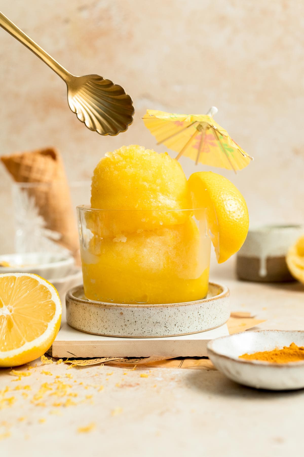 Looking for a refreshing summer treat? Try this easy, all-natural lemon sorbet, made with the added health benefits of turmeric for a bright yellow color. | aheadofthyme.com