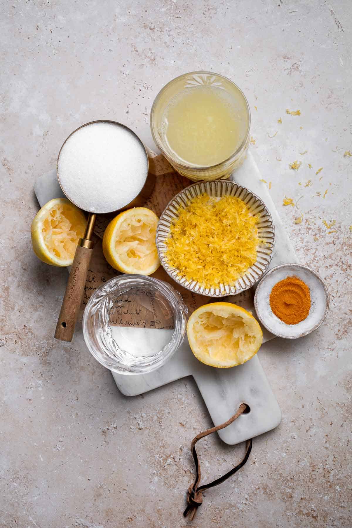 Looking for a refreshing summer treat? Try this easy, all-natural lemon sorbet, made with the added health benefits of turmeric for a bright yellow color. | aheadofthyme.com