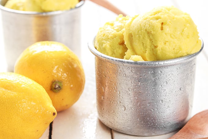 Grab a few easy ingredients, throw them in the blender and in a fews hours, a refreshing and unbelievably healthy lemon turmeric sorbet will be all set and ready for digging in!! | aheadofthyme.com