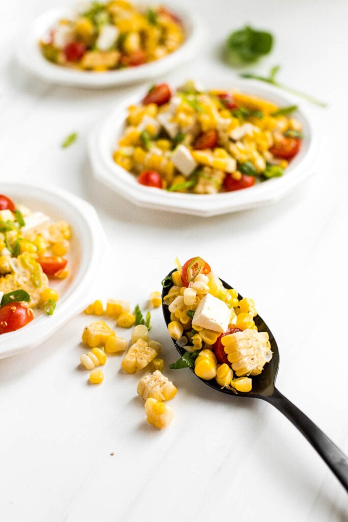 Summer corn salad is loaded to the brim with grilled corn, sweet cherry tomatoes, ricotta salata cheese, and fresh basil for that signature summer taste. | aheadofthyme.com