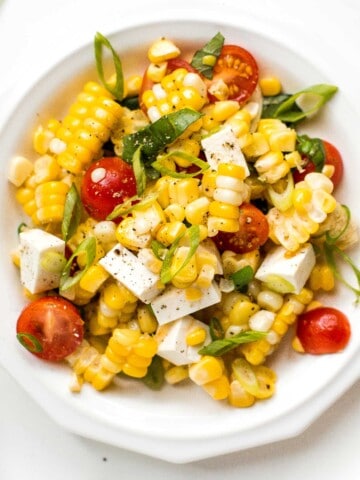 Summer corn salad is loaded to the brim with grilled corn, sweet cherry tomatoes, ricotta salata cheese, and fresh basil for that signature summer taste. | aheadofthyme.com