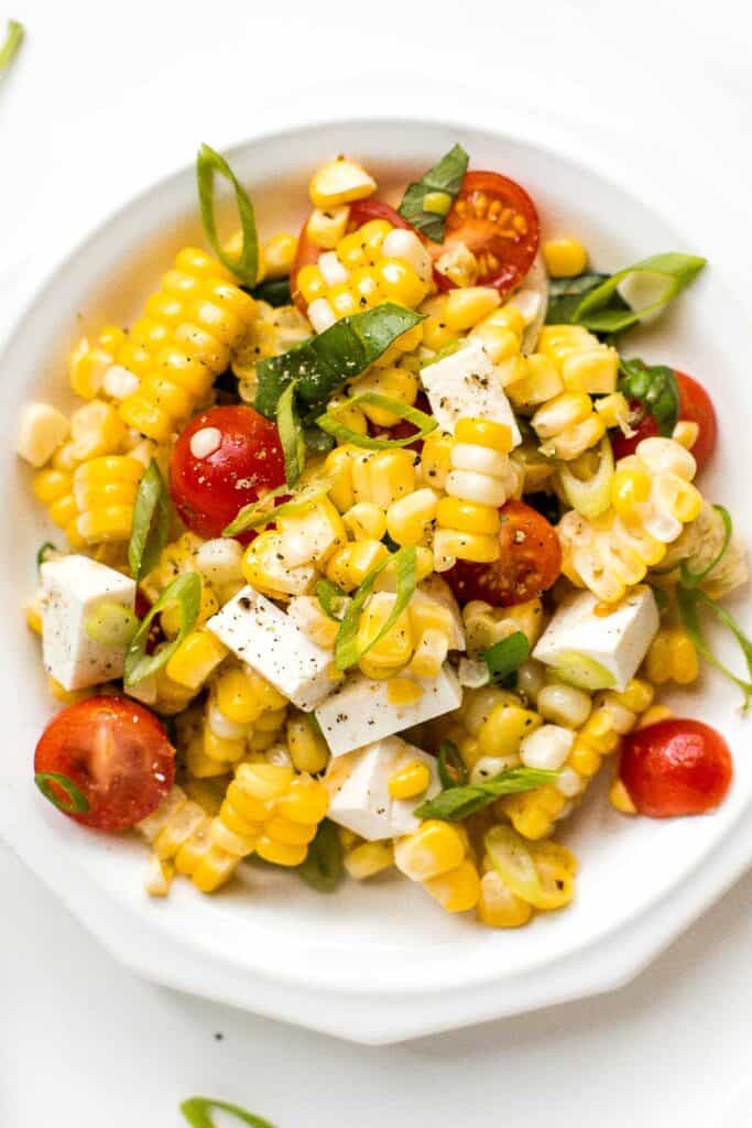Summer corn salad is loaded to the brim with grilled corn, sweet cherry tomatoes, ricotta salata cheese, and fresh basil for that signature summer taste. | aheadofthyme.com