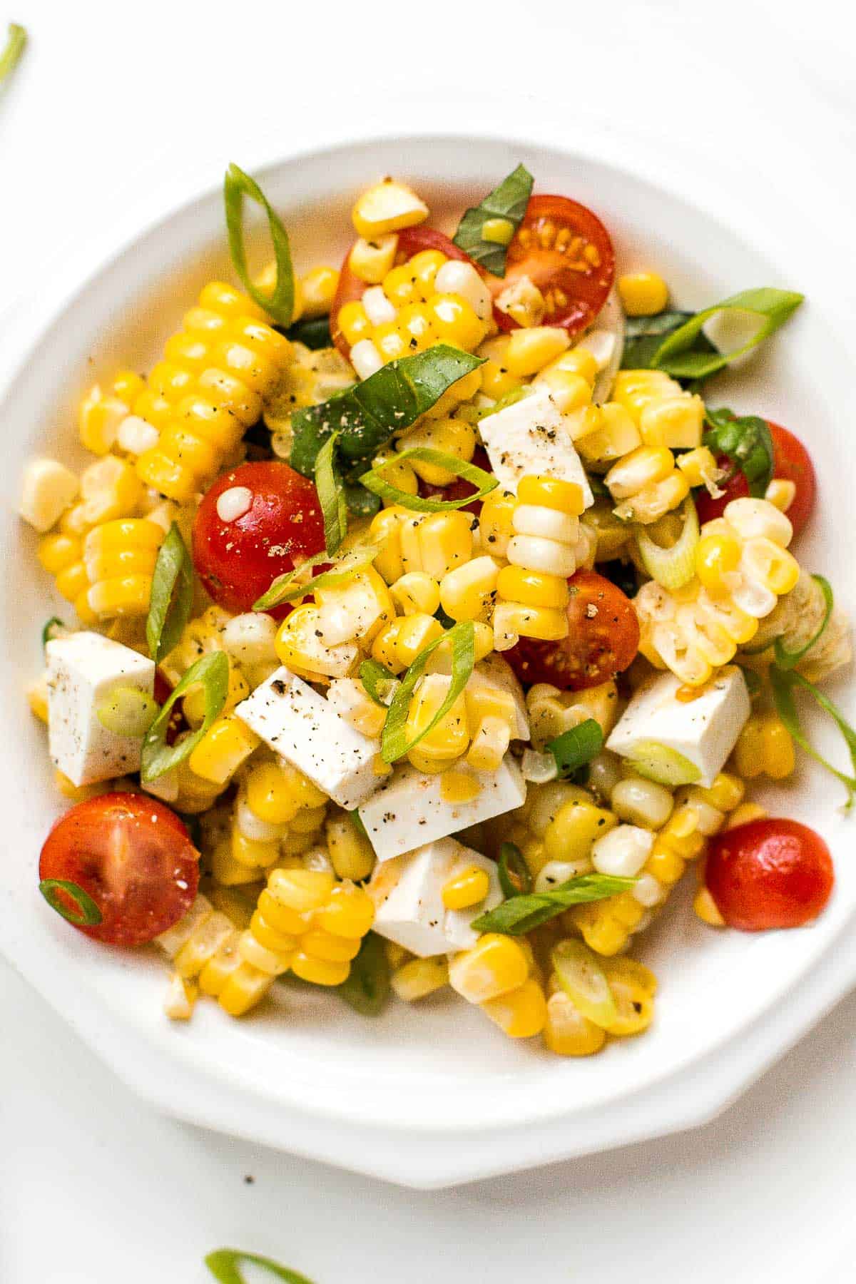 Summer corn salad is loaded to the brim with grilled corn, sweet cherry tomatoes, ricotta salata cheese, and fresh basil for that signature summer taste. | aheadofthyme.com