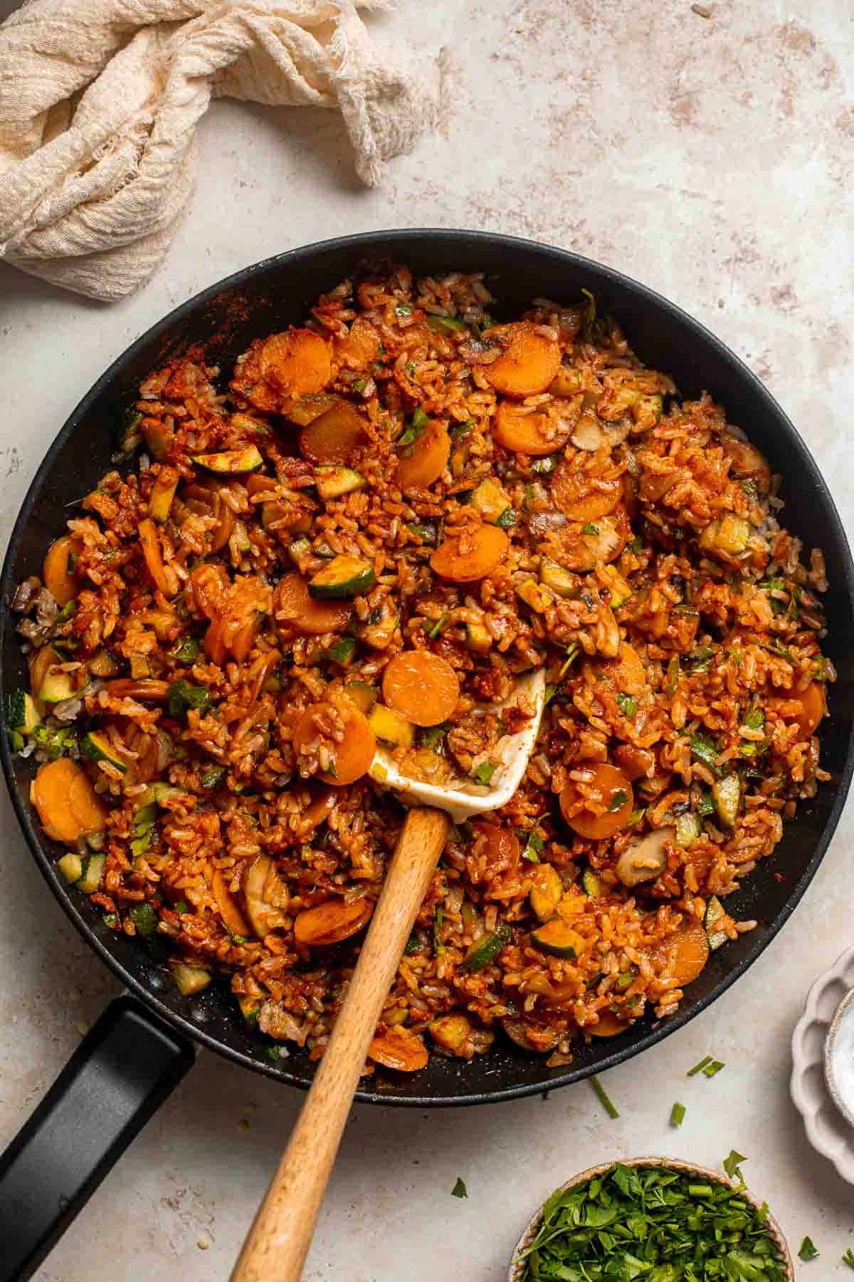 Vegan Stuffed Peppers are stuffed with pan-fried mushrooms, tender rice, and veggies, making them flavorful and filling. Easy to make in under an hour! | aheadofthyme.com