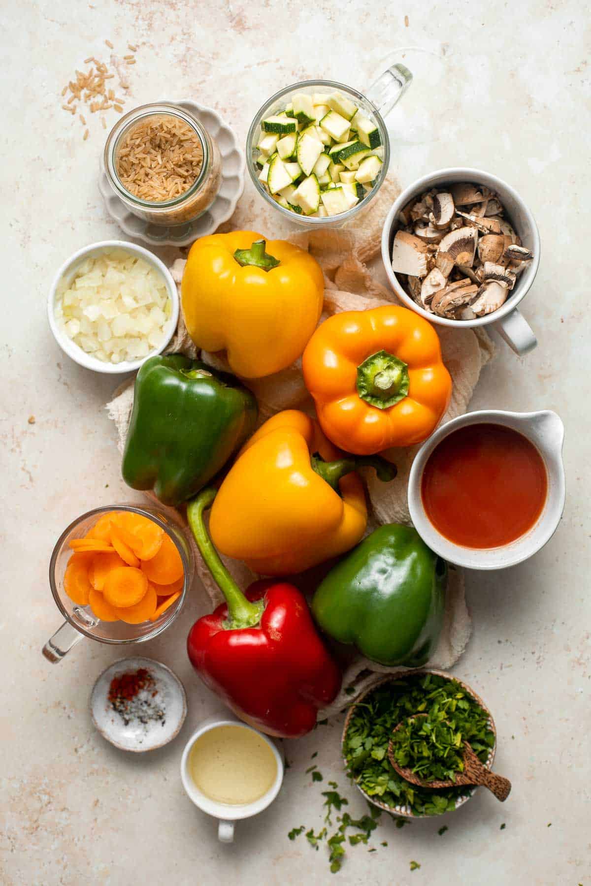 Vegan Stuffed Peppers are stuffed with pan-fried mushrooms, tender rice, and veggies, making them flavorful and filling. Easy to make in under an hour! | aheadofthyme.com