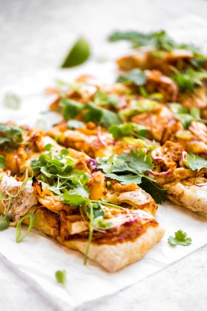 Forget delivery and make sweet, tangy, and smoky BBQ chicken pizza from the comfort of your own home in under 30 minutes. The easiest weeknight dinner. | aheadofthyme.com