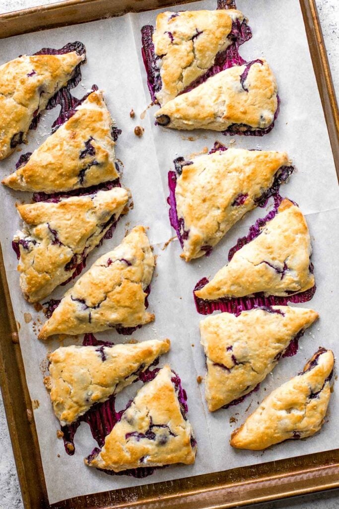 Light, tender and flakey, glazed lemon blueberry scones are crunchy and golden on the outside, soft and moist in the middle, with a drizzle of lemon glaze. | aheadofthyme.com