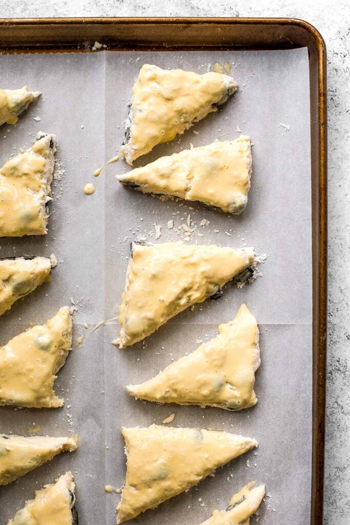 Light, tender and flakey, glazed lemon blueberry scones are crunchy and golden on the outside, soft and moist in the middle, with a drizzle of lemon glaze. | aheadofthyme.com