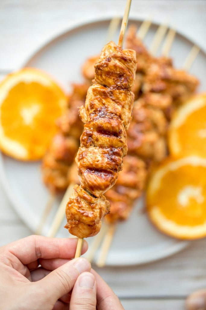 Flame-kissed, sticky and saucy, grilled orange chicken skewers with a rich, citrus-based marinade are delicious, juicy and so tender. Best weeknight dinner. | aheadofthyme.com