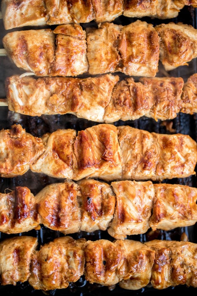 Flame-kissed, sticky and saucy, grilled orange chicken skewers with a rich, citrus-based marinade are delicious, juicy and so tender. Best weeknight dinner. | aheadofthyme.com