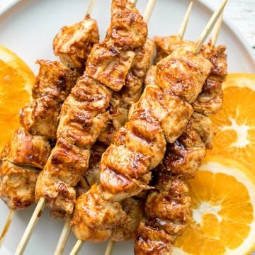 Flame-kissed, sticky and saucy, grilled orange chicken skewers with a rich, citrus-based marinade are delicious, juicy and so tender. Best weeknight dinner. | aheadofthyme.com