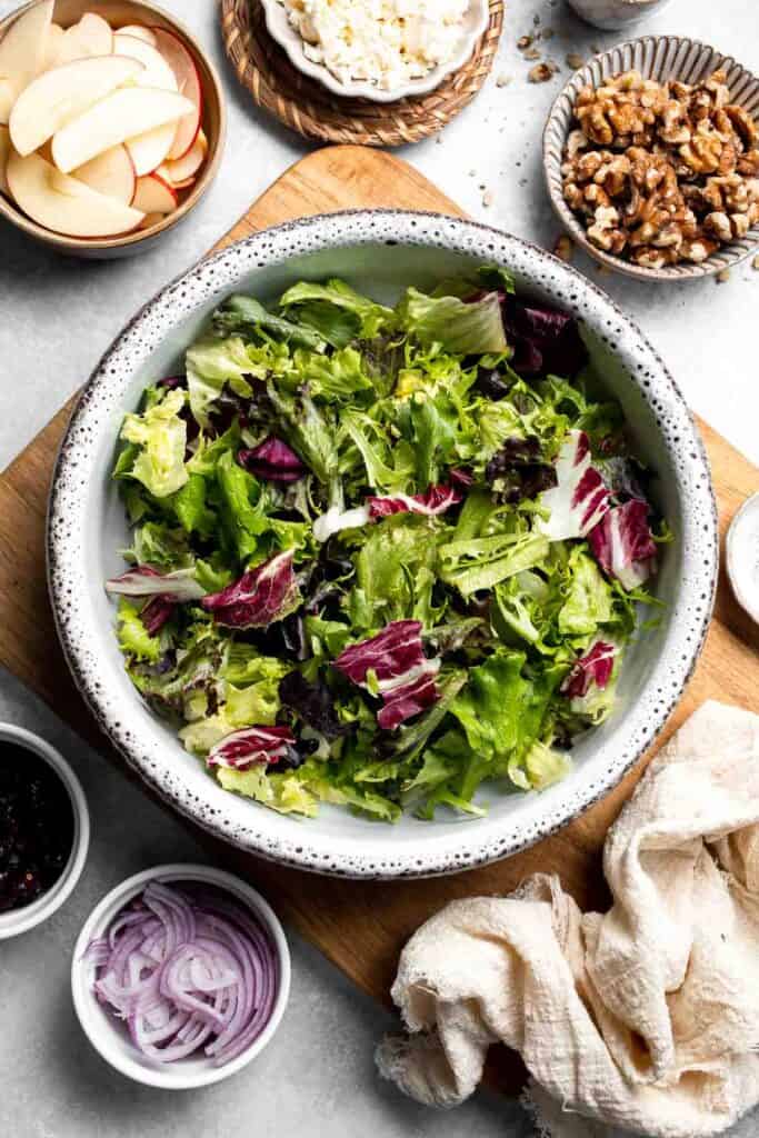 Delicious apple walnut salad with crisp apples, crunchy walnuts, and tangy balsamic vinaigrette. A healthy, easy side dish or lunch! | aheadofthyme.com