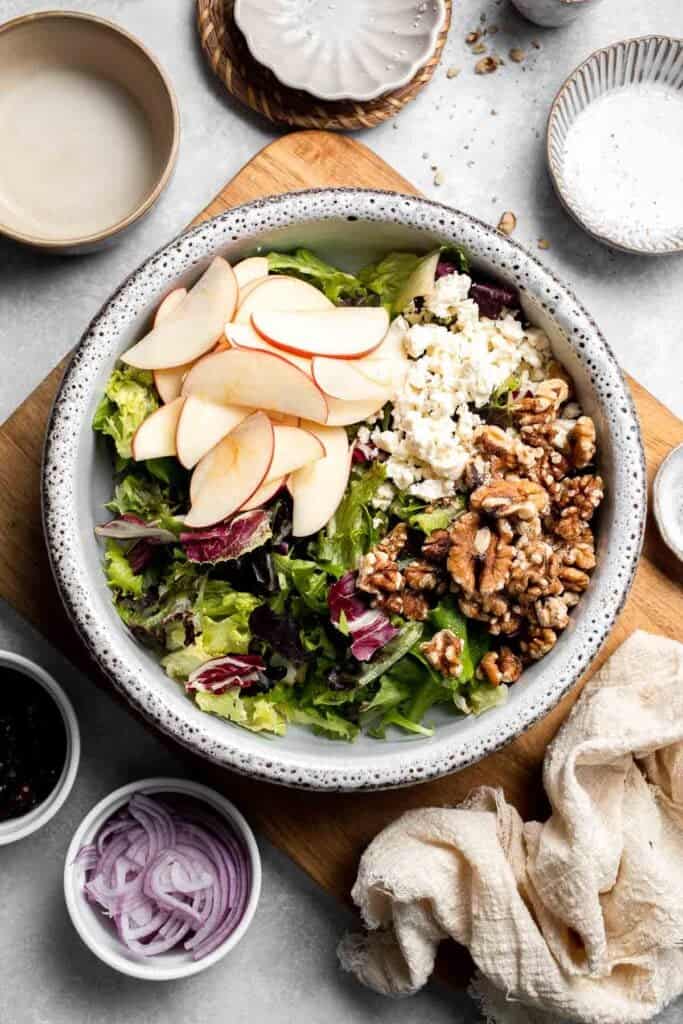 Delicious apple walnut salad with crisp apples, crunchy walnuts, and tangy balsamic vinaigrette. A healthy, easy side dish or lunch! | aheadofthyme.com