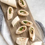 Turkey pinwheels are bite-sized finger food perfection and will make back-to-school lunch planning for the kids, entertaining guests at lunchtime, or serving appys at game day a total breeze! | aheadofthyme.com