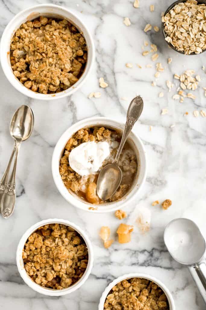 Individual apple crisp is a sweet tart fall dessert served in single-sized portions with all the crunchy corners of crumble. And so quick and easy to prep. | aheadofthyme.com