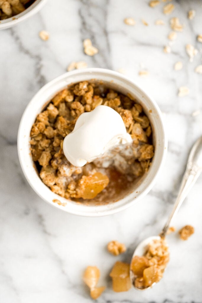 Individual apple crisp is a sweet tart fall dessert served in single-sized portions with all the crunchy corners of crumble. And so quick and easy to prep. | aheadofthyme.com