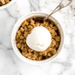 Individual apple crisp is a sweet tart fall dessert served in single-sized portions with all the crunchy corners of crumble. And so quick and easy to prep. | aheadofthyme.com