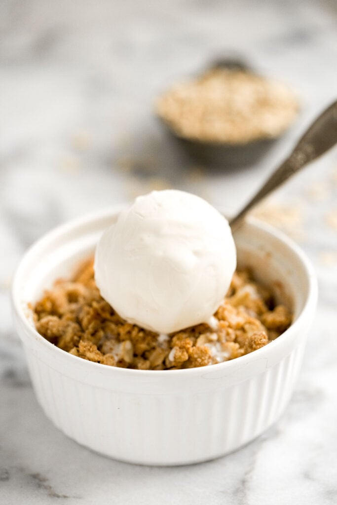 Individual apple crisp is a sweet tart fall dessert served in single-sized portions with all the crunchy corners of crumble. And so quick and easy to prep. | aheadofthyme.com